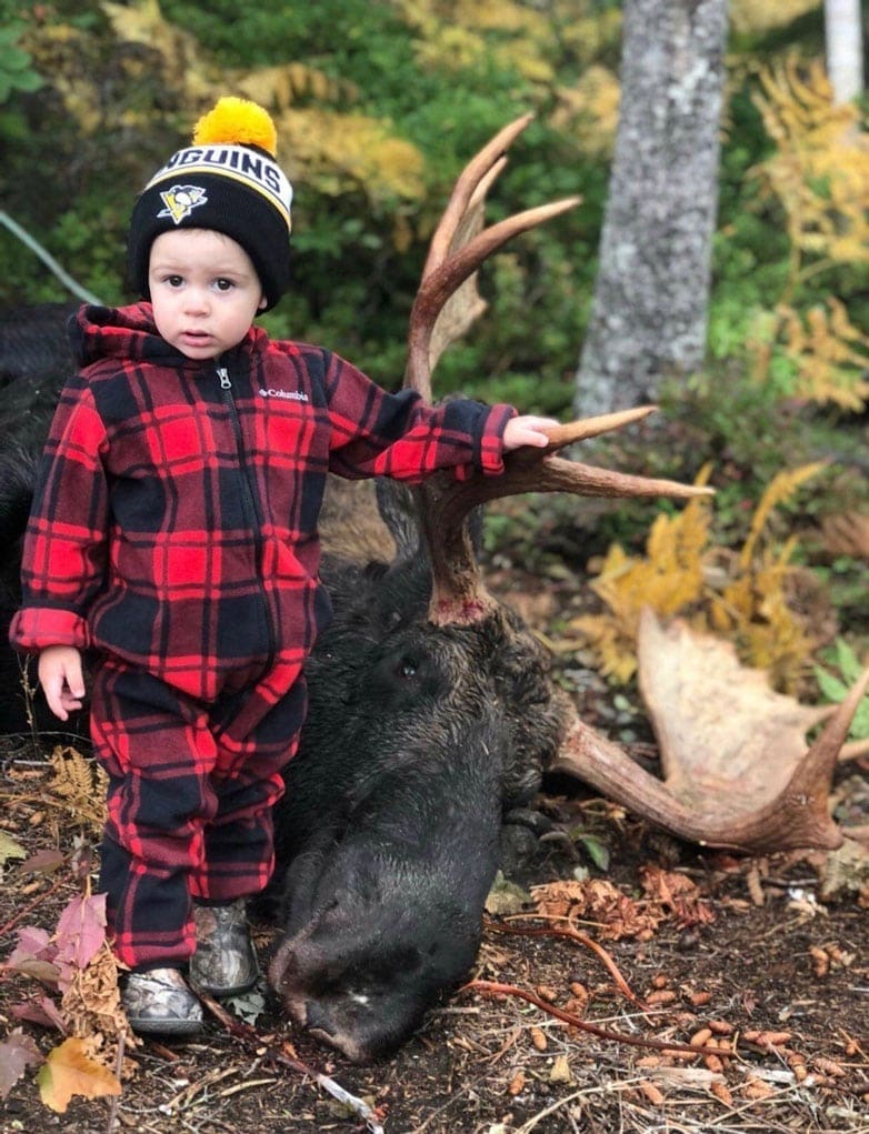 A Future Hunter in the Making! Photo of Baby Jaxson with a nice Bull Moose harvested on our October 4th. 2018 Neil’s Harbour Cape Breton Moose Hunting Trip. The Moose was shot by Kris Kirk with a Browning 300 Magnum.