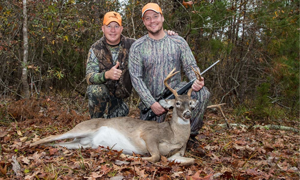 Successful Deer Hunter with a Whitetail Deer Buck - Hunting Magazine