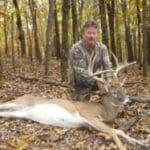 Deer hunter with trophy buck