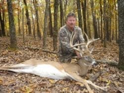 Deer hunter with trophy buck