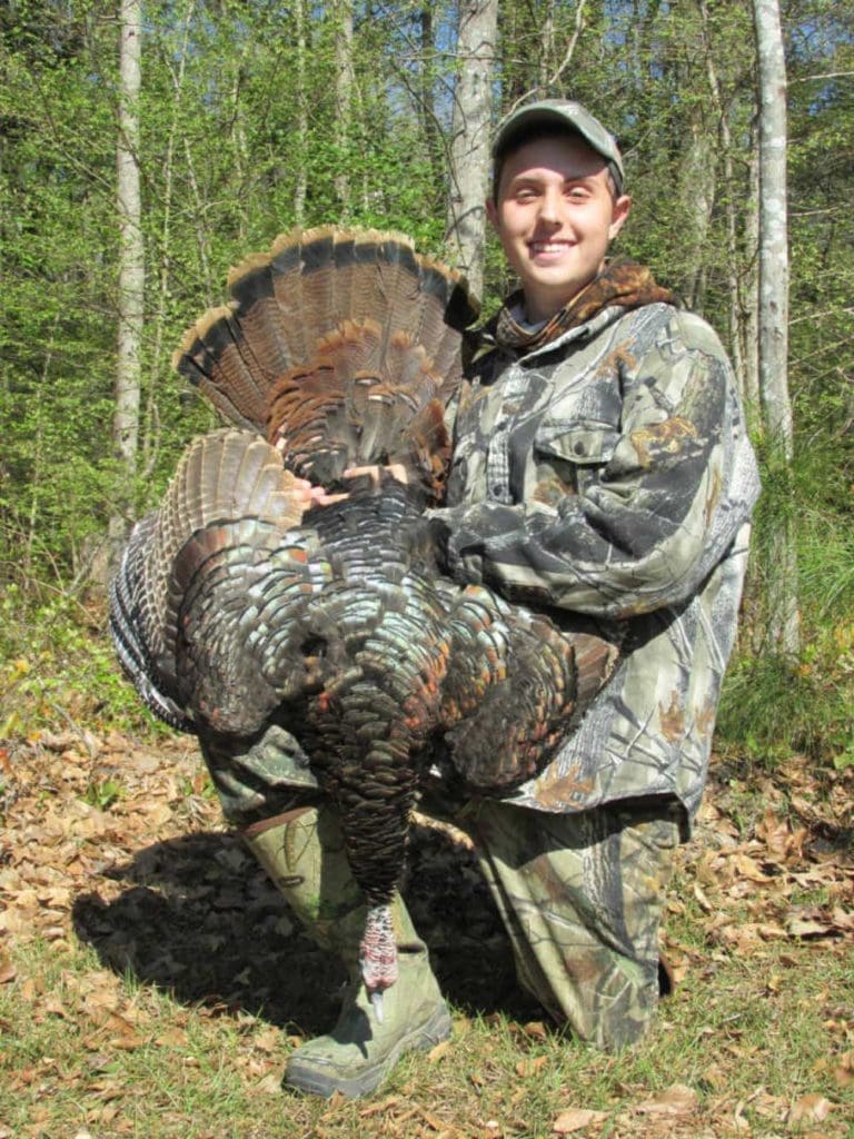 Successful Youth Hunter with Wild Turkey