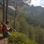 Hiker Resting in Mountains