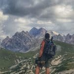 Hiker Resting in Mountains