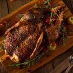 Wild Roasted Duck with Herbs and Spices on Cutting Board