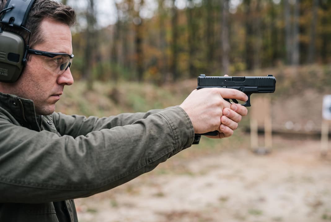 At the Firing Range with 9mm pistol in hand